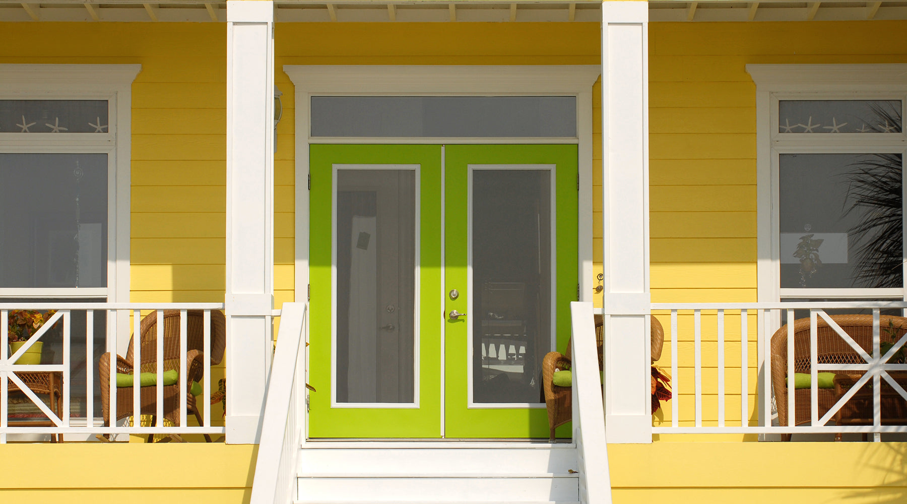 Picture of a home with a front porch and lime green door